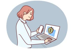 Een vrouw bediend een laptop met een op het scherm