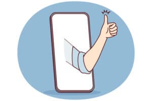 Phone met arm en opgestoken duim