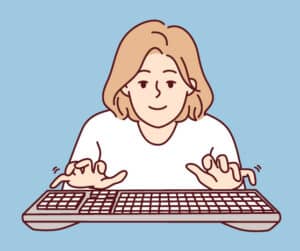 Een vrouw die druk aan het typen is op een laptop